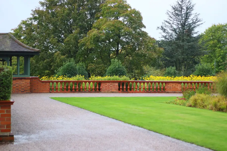 Lawn and terrace in a completed garden phase in Hertfordshire, looking finished rather than half built