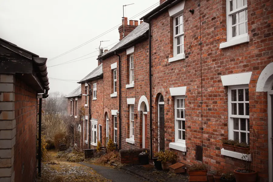 Narrow lane between Victorian brick terraces, the kind of restricted access that raises garden build costs in St Albans
