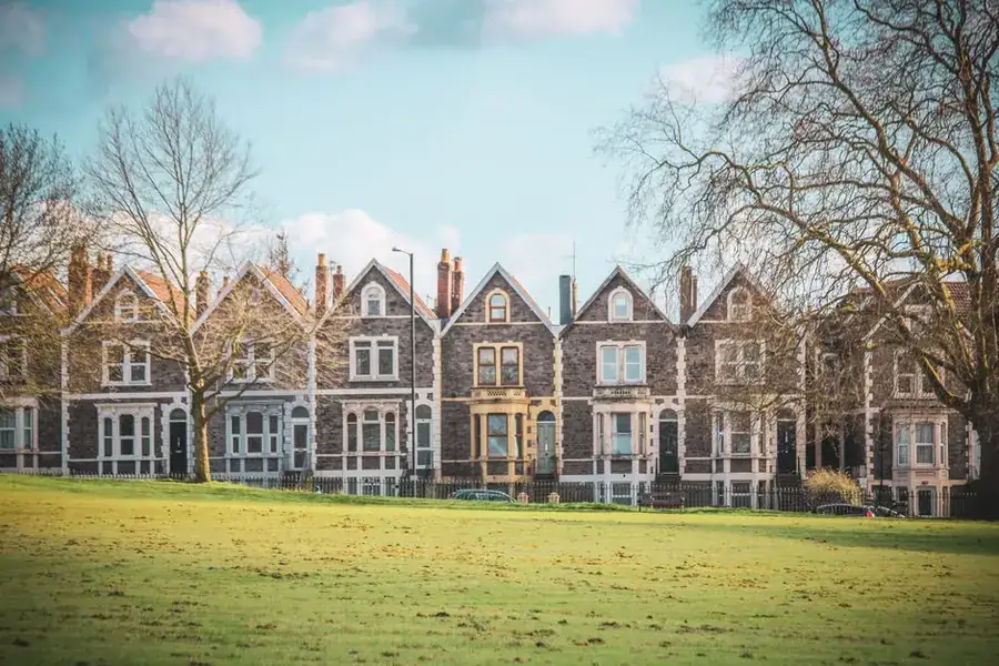 Row of Victorian terraced houses overlooking a green, the housing type behind many long narrow gardens
