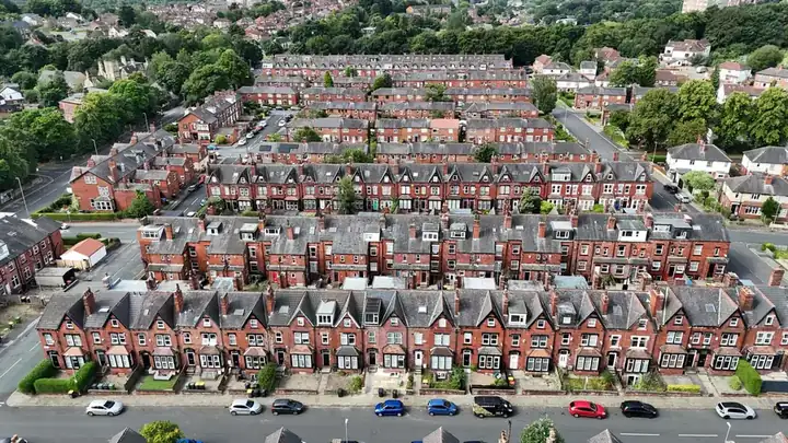 Aerial view of rows of Victorian terraced houses and their long, narrow back gardens divided by fences